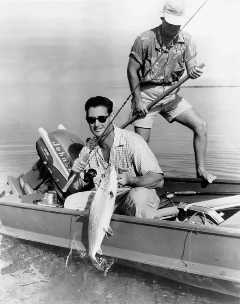 Ted Williams fishing in 1955 wearing AO Cosmetan lenses